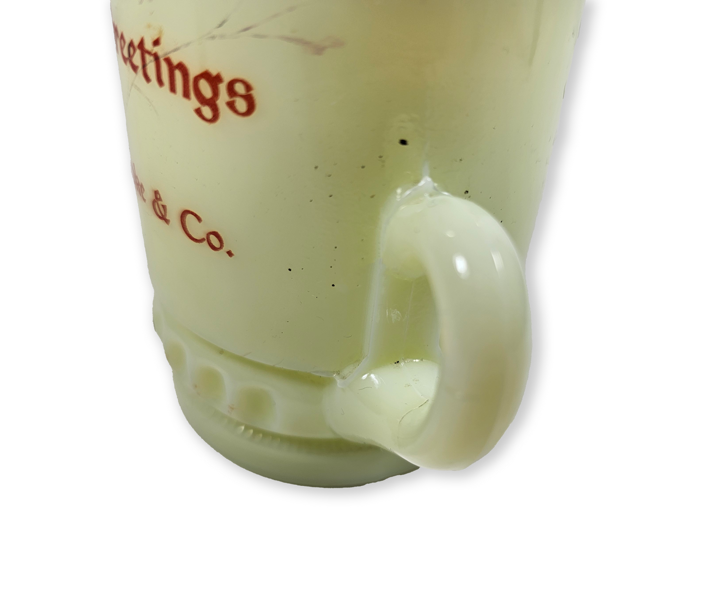 Close-up of a uraniuum glass mug on a white background