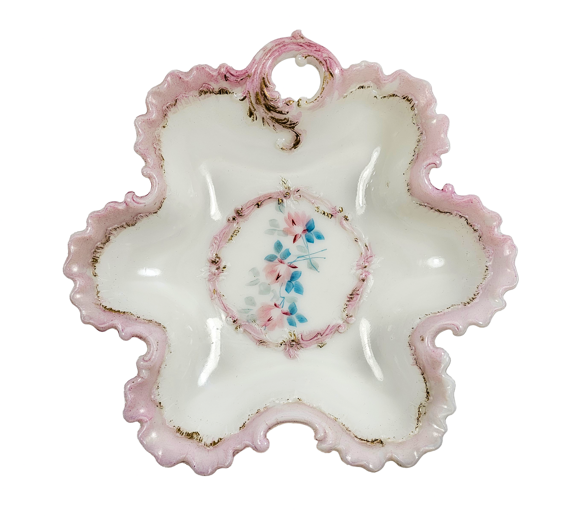 Decorative ceramic plate with pink rim and floral center on a white background