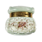 Decorative ceramic jar with floral design and gold accents on a white background
