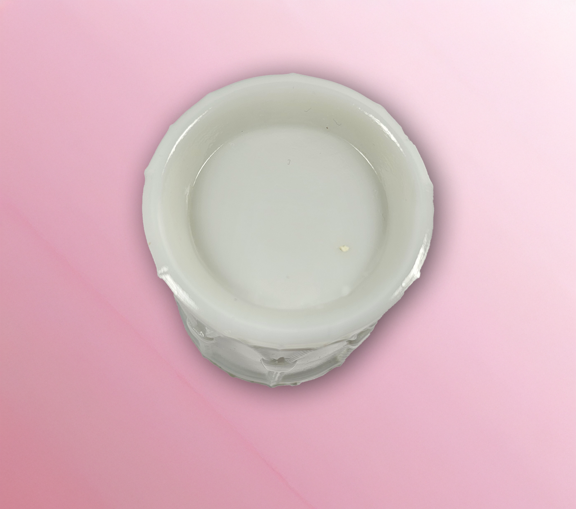 Bottom of a milk glass candy container