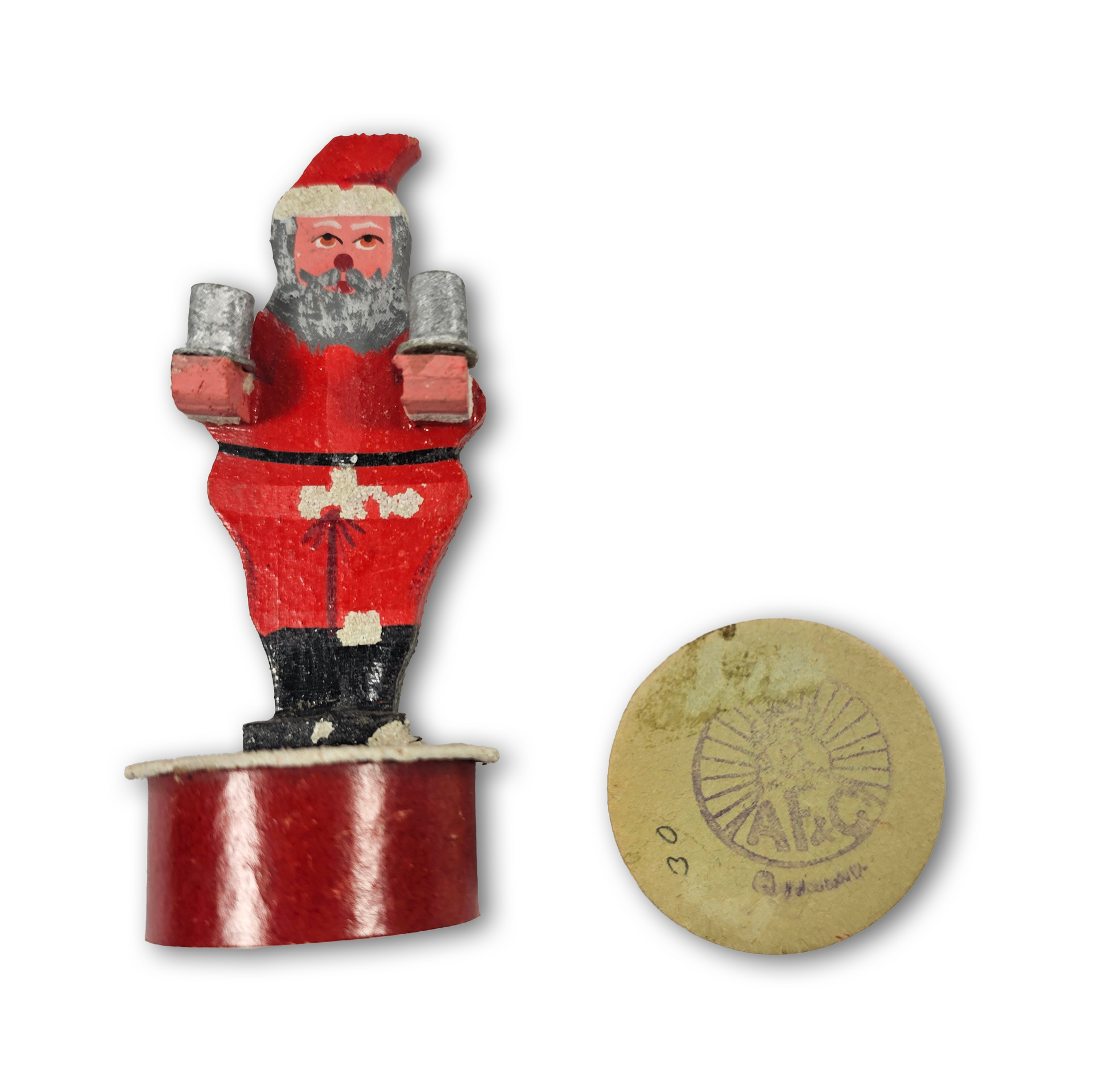 Vintage Santa Claus figurine with a circular logo at the bottom right corner on a white background