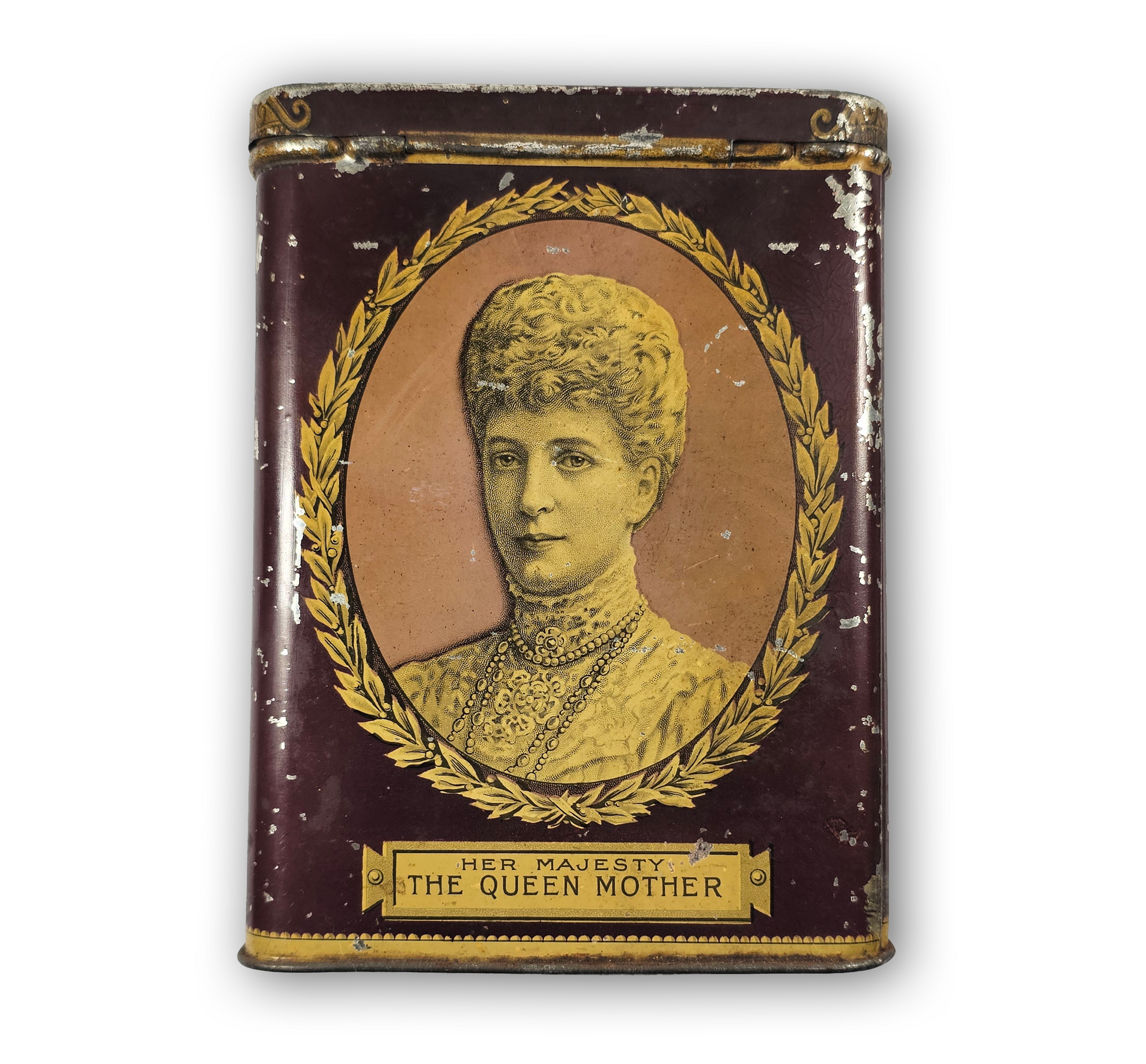 Vintage tin with portrait of a woman labeled 'Her Majesty The Queen Mother' on a white background