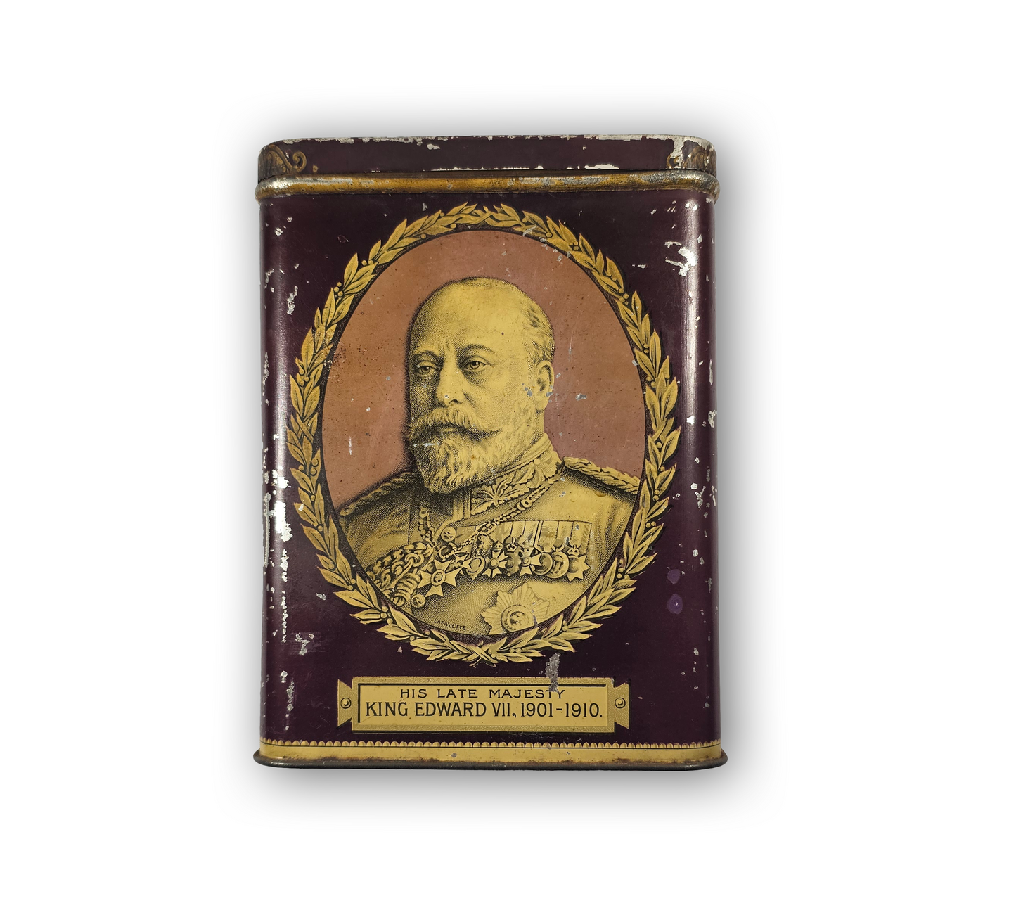 Vintage tin with portrait of King Edward VII on a white background