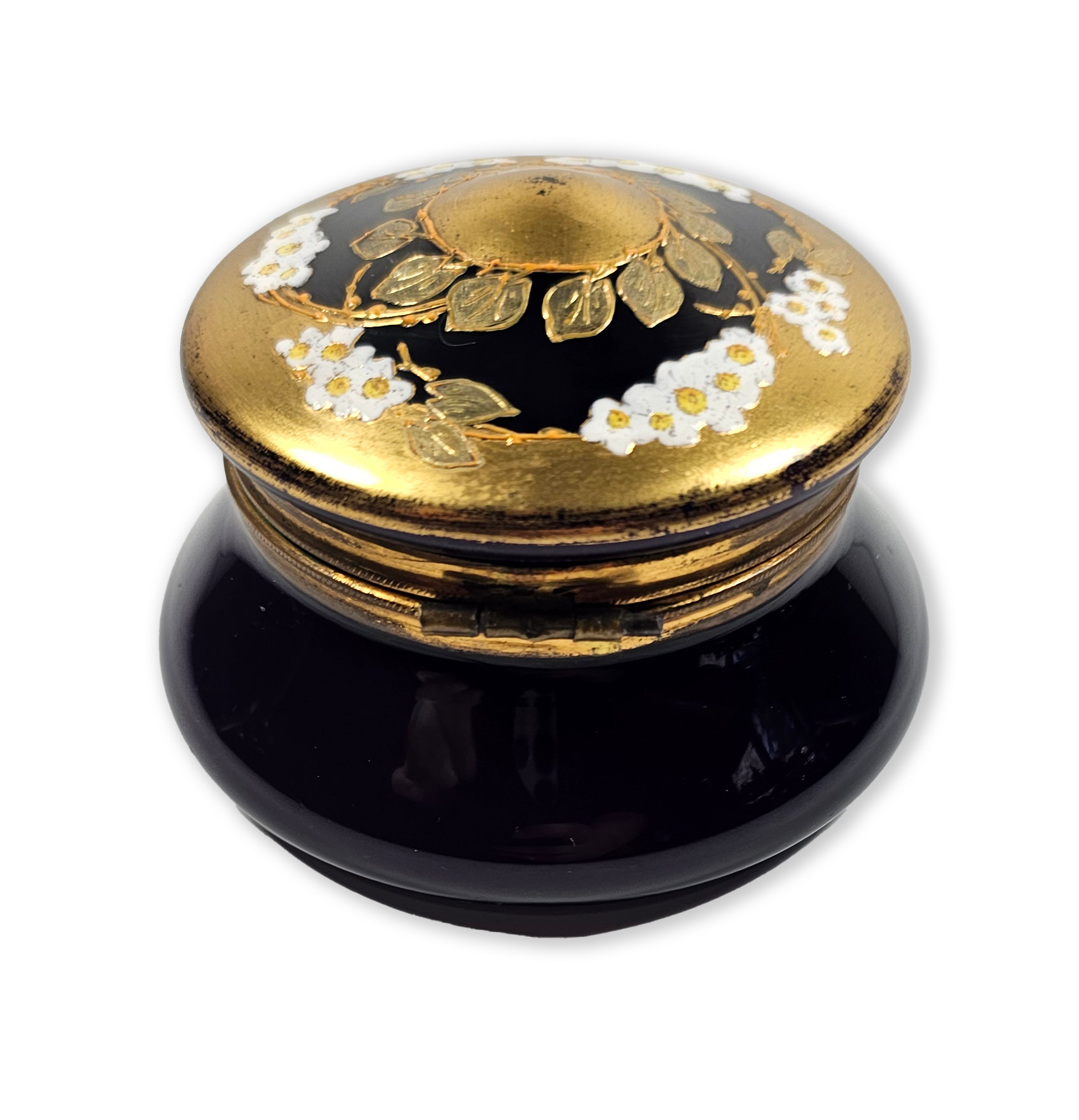 Decorative dark purple and gold box with floral design on a white background