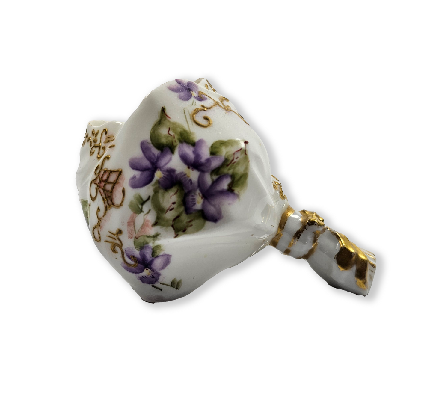 Decorative ceramic flower holder with gold accents and floral patterns on a white background
