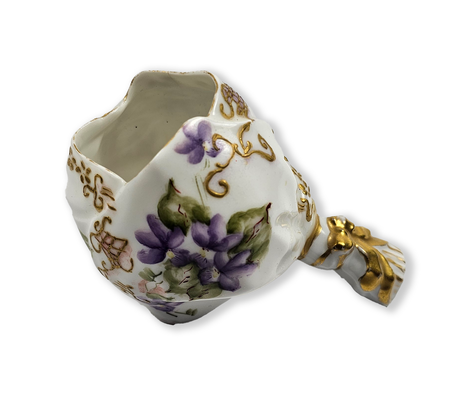 Decorative ceramic item with floral design and gold accents on a white background