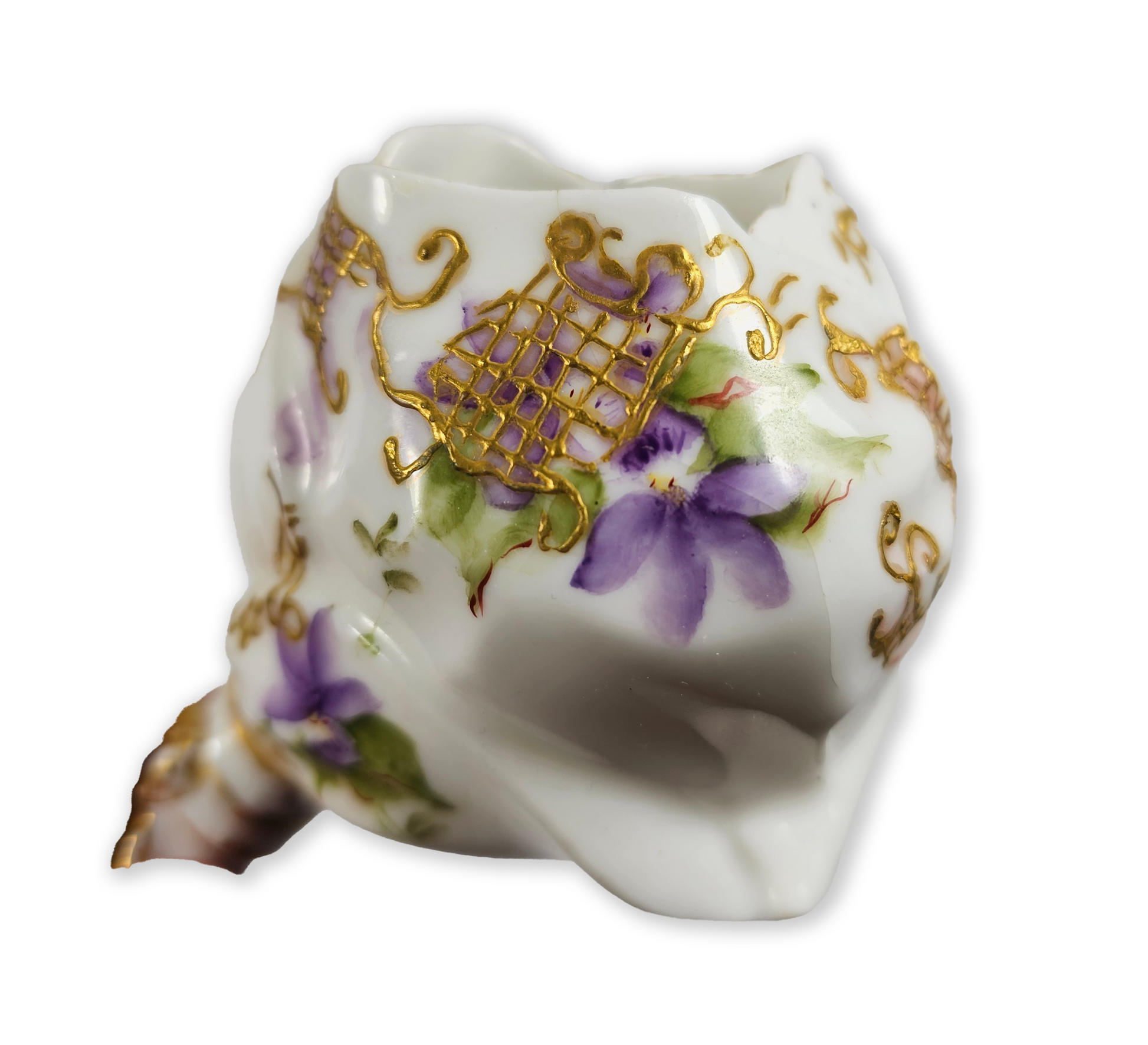 Decorative ceramic vase with floral and gold patterns on a white background