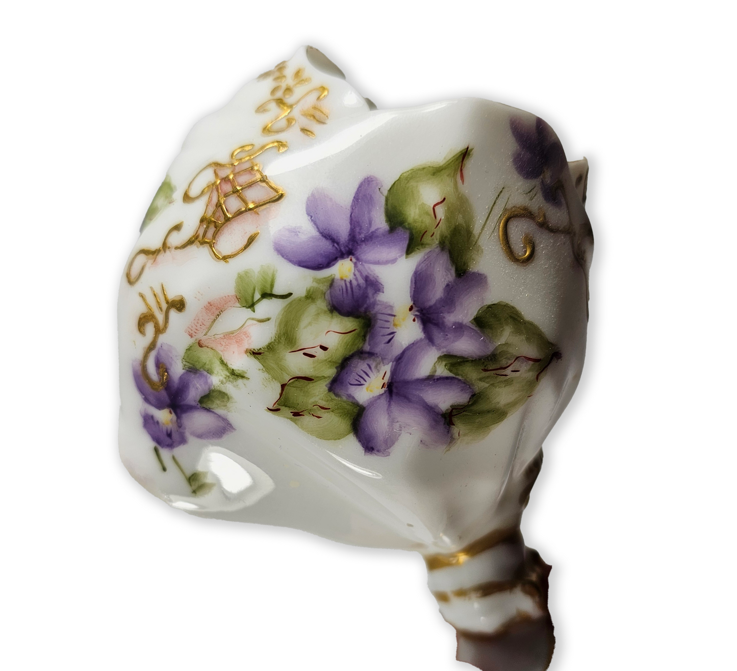 Decorative ceramic flower holder with gold accents and floral patterns on a white background