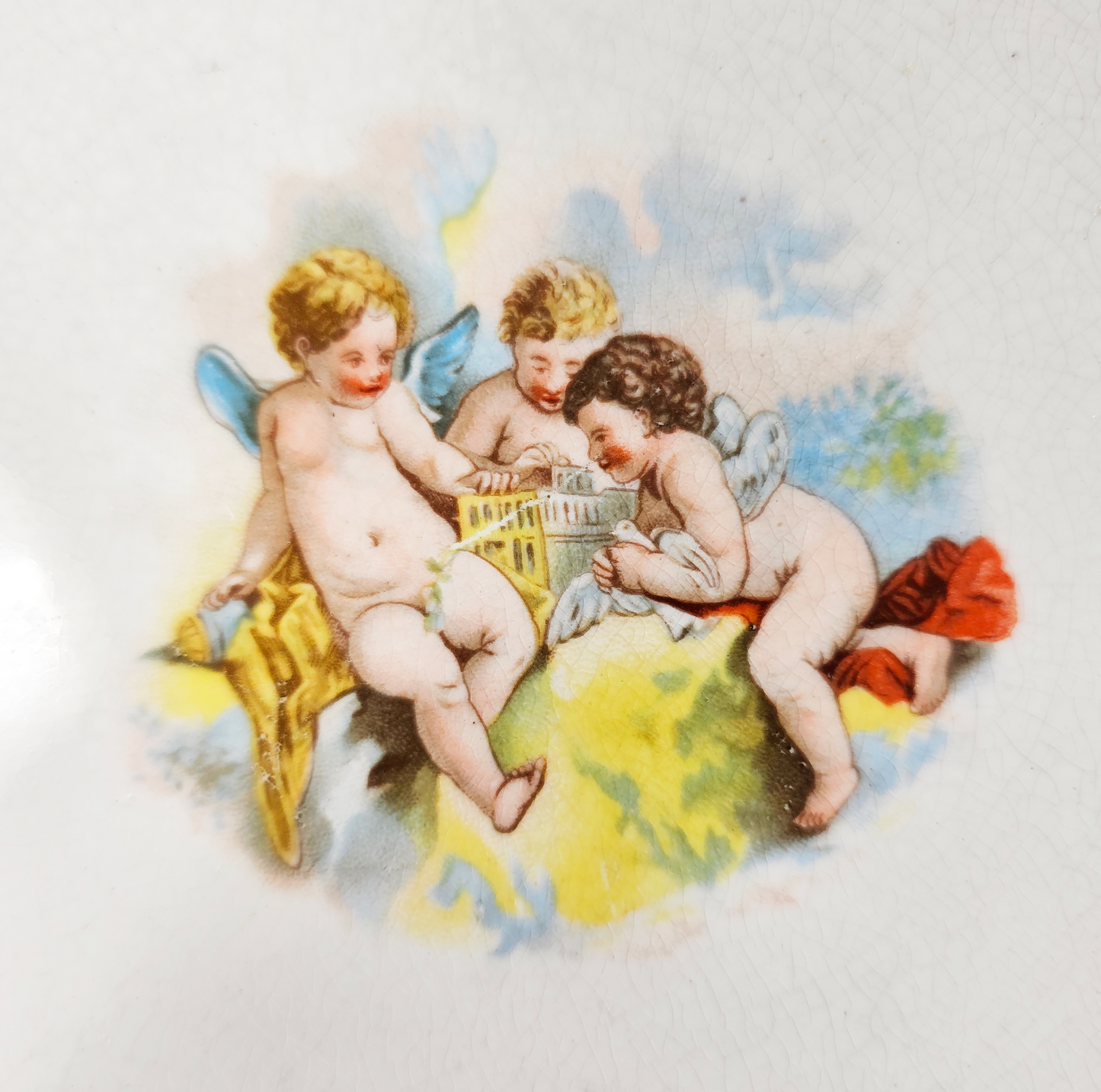 Vintage-style illustration of three cherubs playing with a basket on a white background
