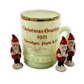 Decorative mug with Christmas gnomes and 'Christmas Greetings 1901' text on a white background