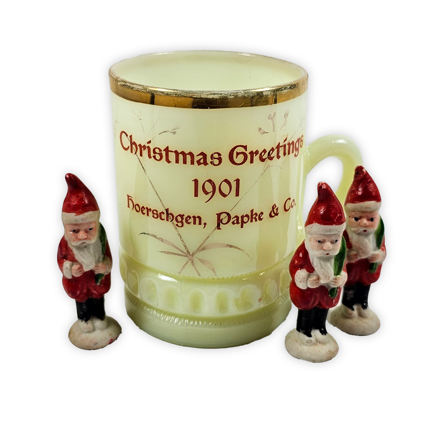 Decorative mug with Christmas gnomes and 'Christmas Greetings 1901' text on a white background