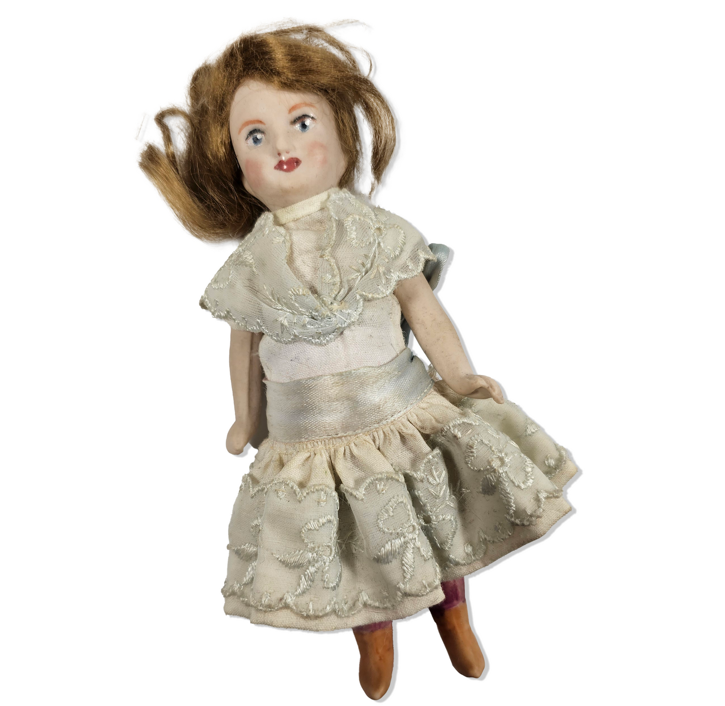 Vintage doll with lace dress on a white background