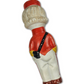 Vintage-style figurine of a character in a red jacket and white pants on a white background