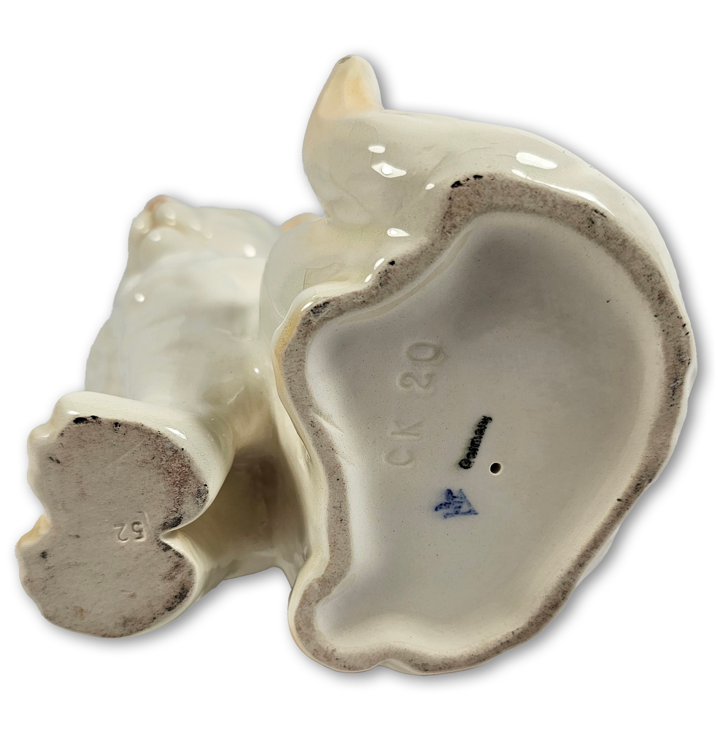 bottom of ceramic cat on a white background