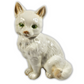 Ceramic cat figurine on a white background