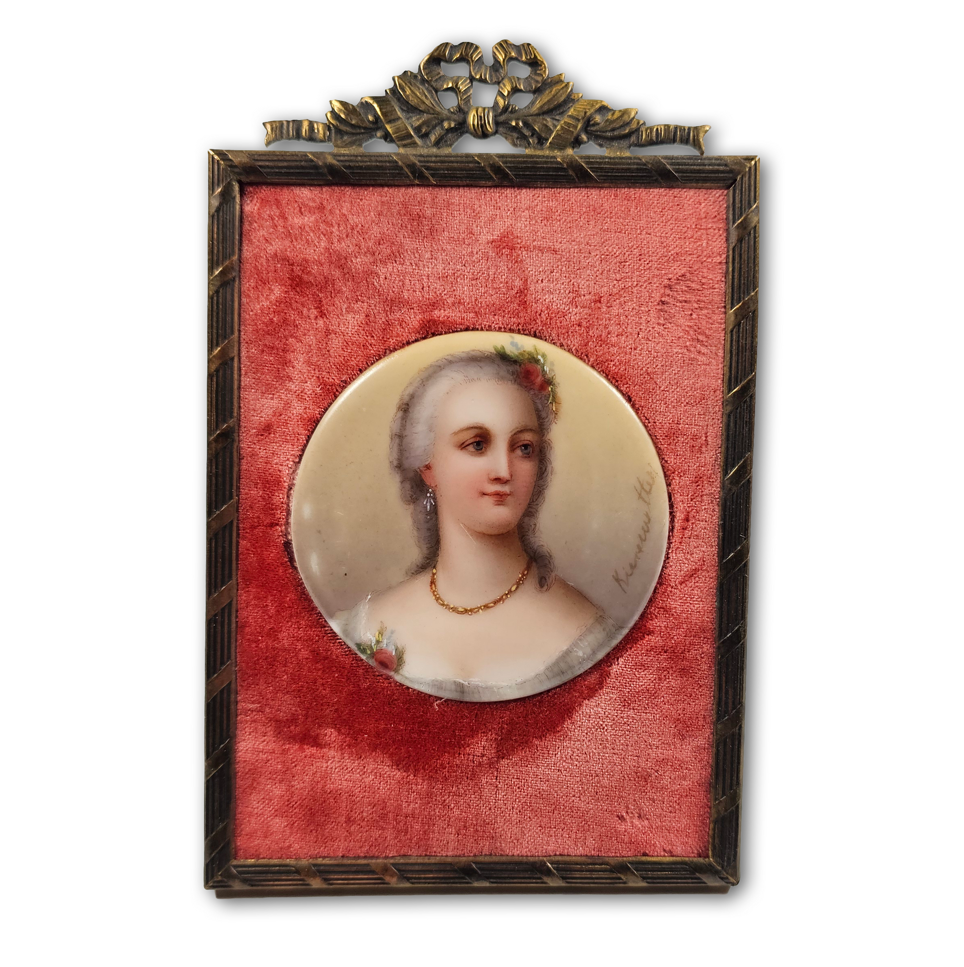 Portrait of a woman in a decorative frame with a red background
