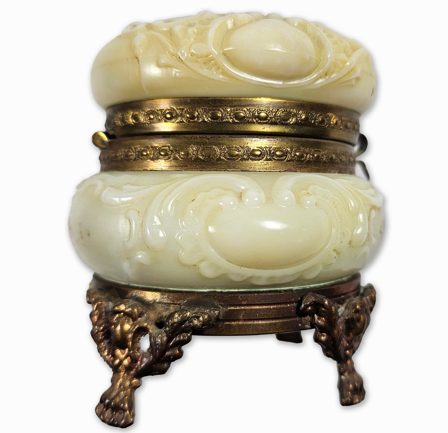 Decorative white container with gold accents on a white background