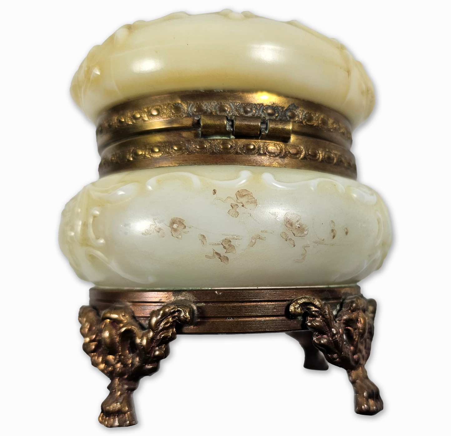 Decorative white container with gold accents on a white background