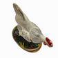 Ceramic rooster figurine on a white background