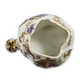 Decorative ceramic flower holder with gold accents and floral patterns on a white background