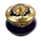 Decorative purple box with gold lid featuring floral designs on a white background