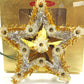 Decorative star with metallic flowers on a gold box labeled '20 Lite Metalized Flower Set'.